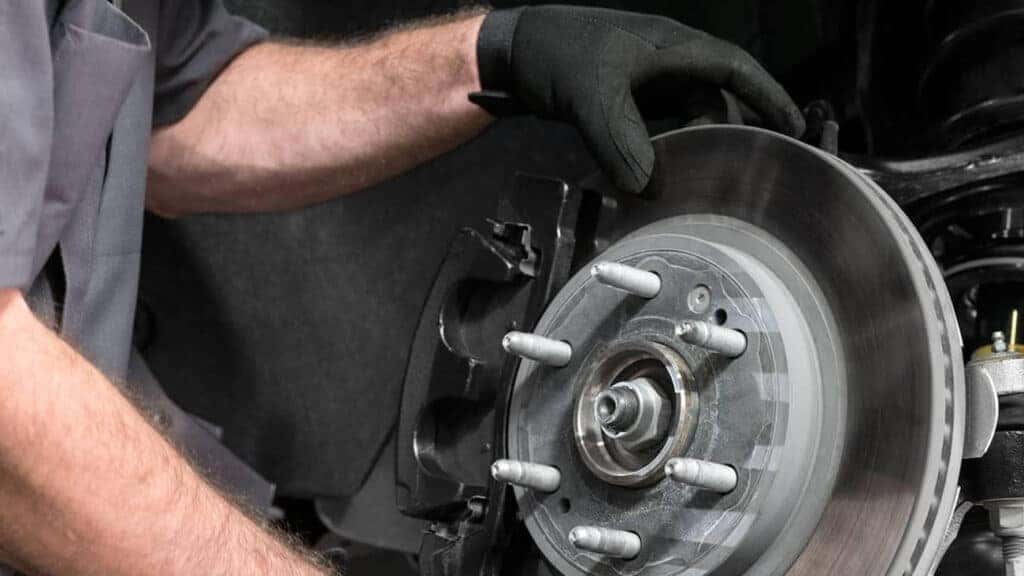 A technician performing routine brake service