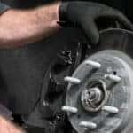 A technician performing routine brake service