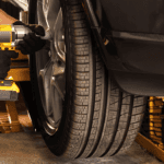 A technician performing a tire rotation