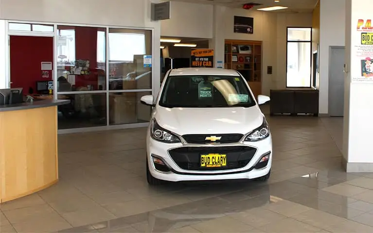 Chevy Bolt parked in the model showroom of Bud Clary Chevrolet of Moses Lake