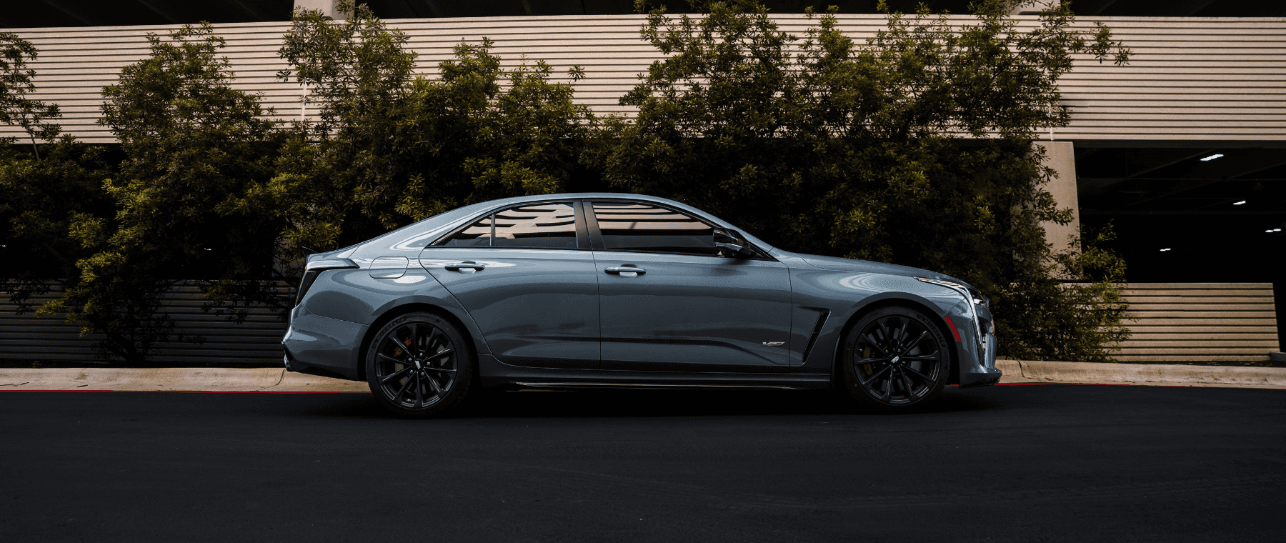 CT4-V Blackwing in front of parking garage