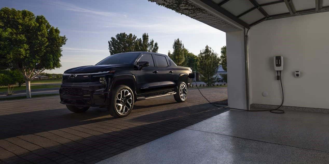 2025 Chevy Silverado EV charging in the driveway