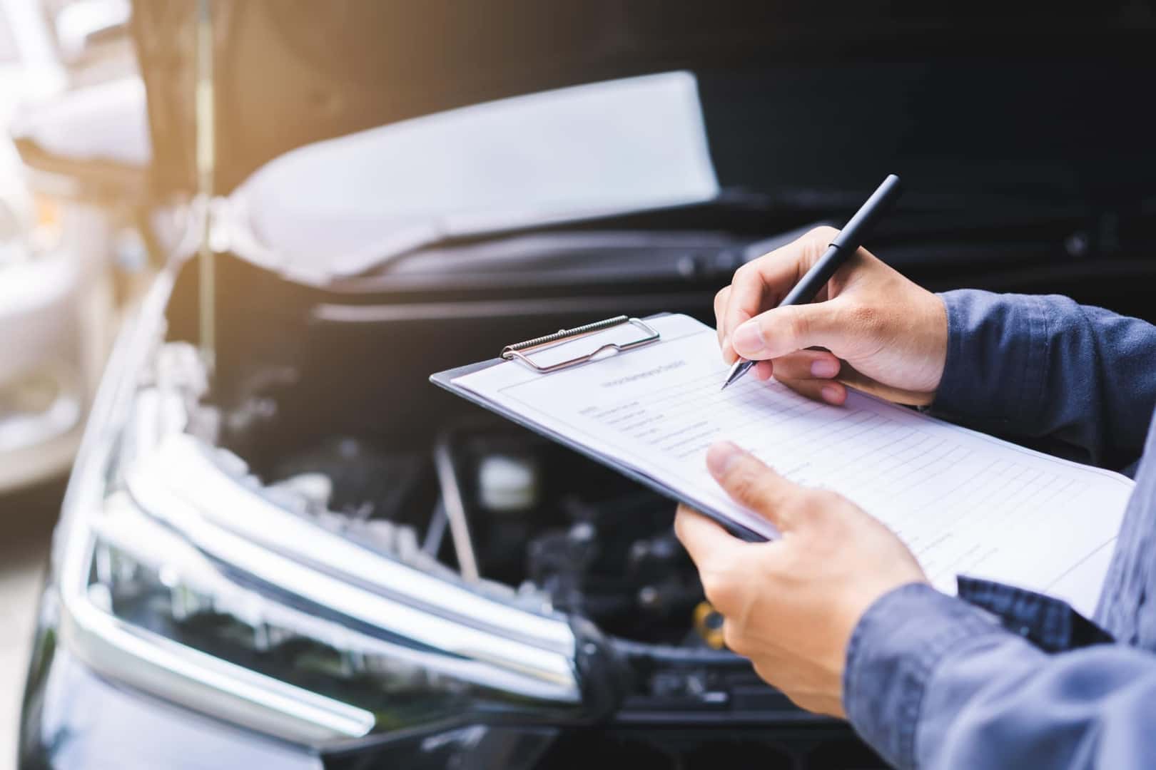 Technician going through Chevy routine maintenance checklist