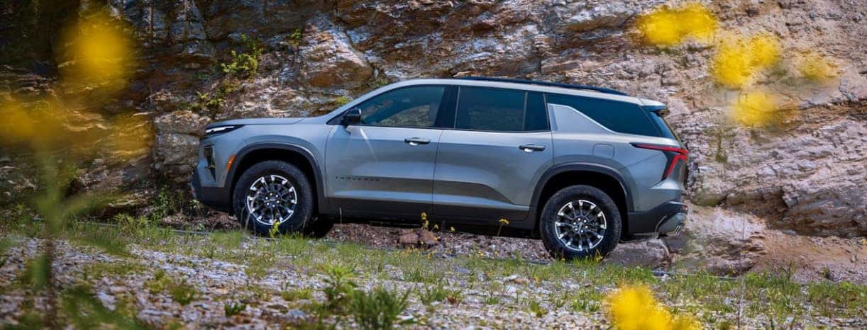 2026 Chevrolet Traverse parked on a hill with flowers