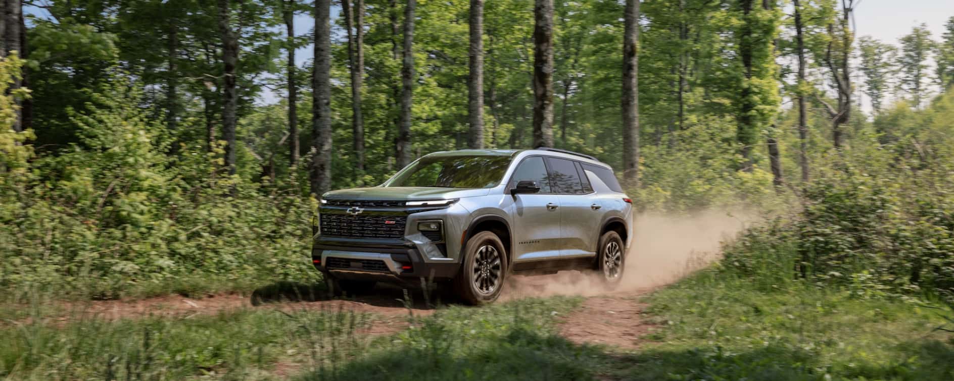 2026 Chevy Traverse driving through the woods