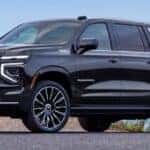 Chevy Suburban parked in front of a beach