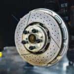 Disk brake being serviced in a mechanic shop