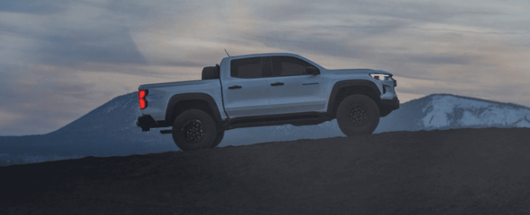 Side view of the 2024 Chevrolet Colorado ZR2 with mountains in the background
