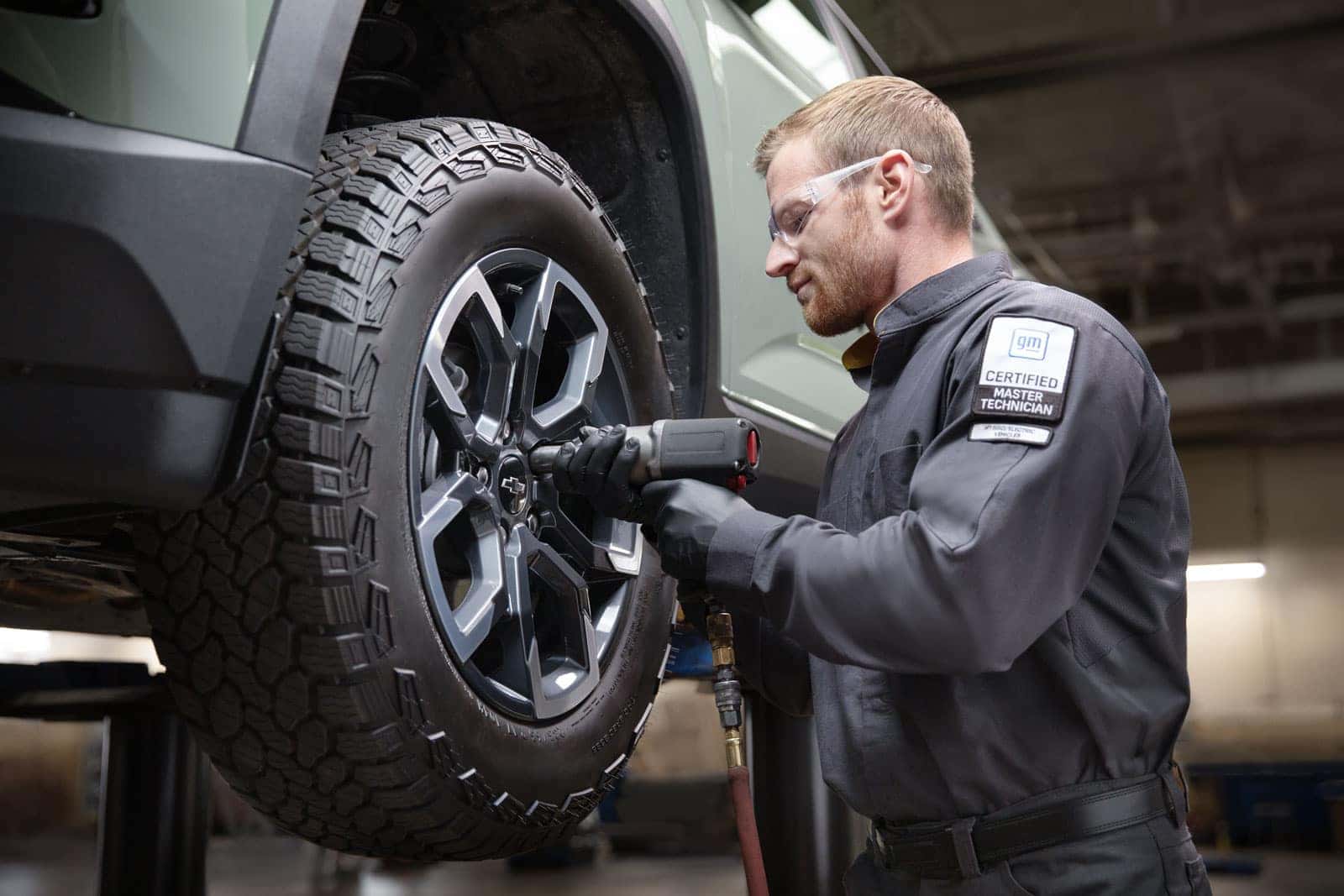 Service advisor explaining diagnostic results and repair estimate to a customer at Emich Chevrolet near Denver and Aurora