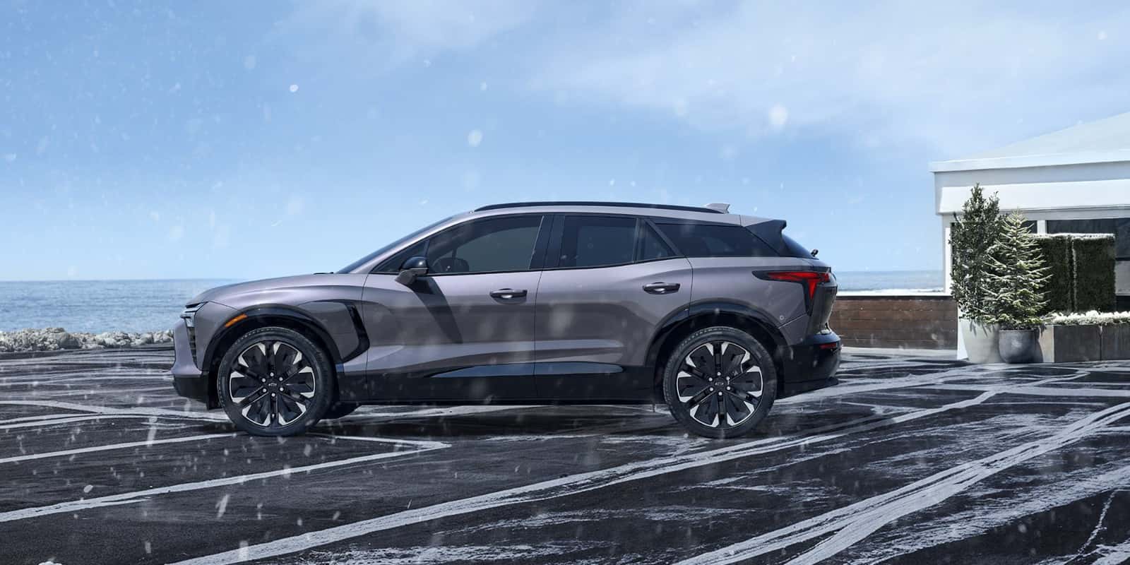 Chevrolet Blazer EV parked in a driveway on a snowy winter day — cold weather EV operation in Colorado