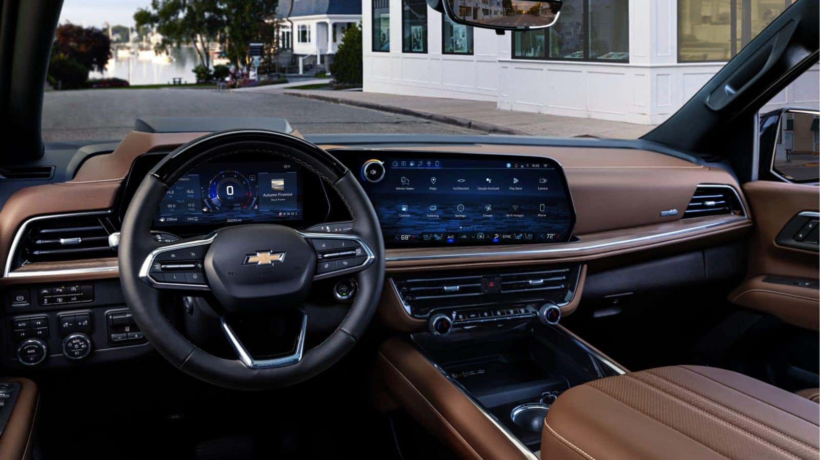 Chevy Suburban dashboard with large center touchscreen and brown leather interior