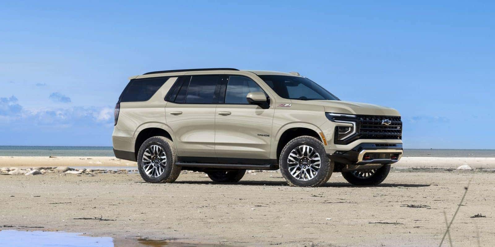 Chevy Tahoe parked on a sandy beach