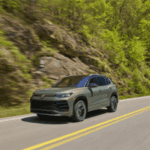2026 Tiguan SEL R-Line Turbo - Avocado Green Driving down highway