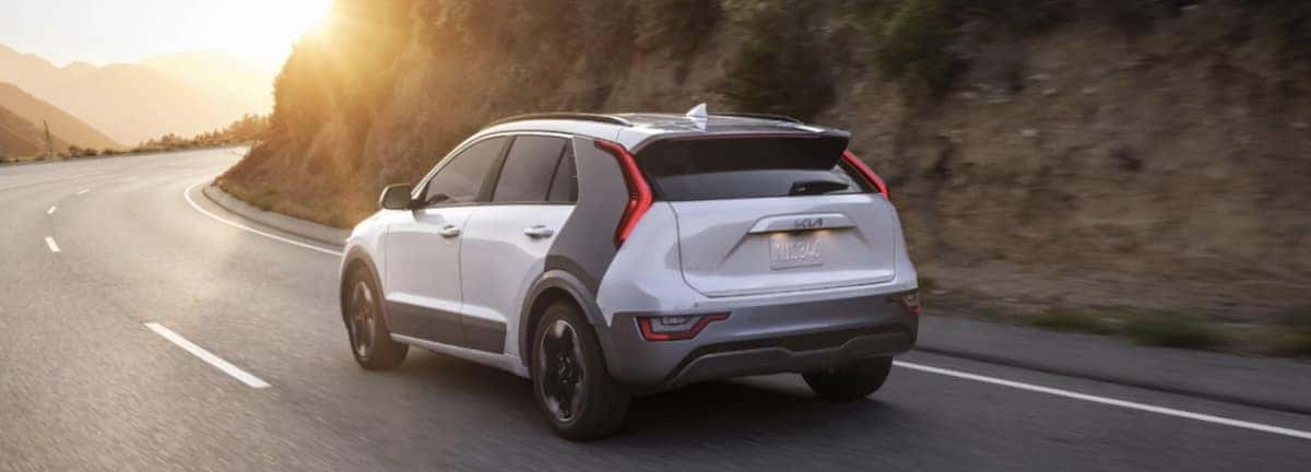 White 2023 Kia Niro driving