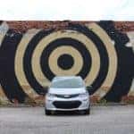 car in front of a painted wall