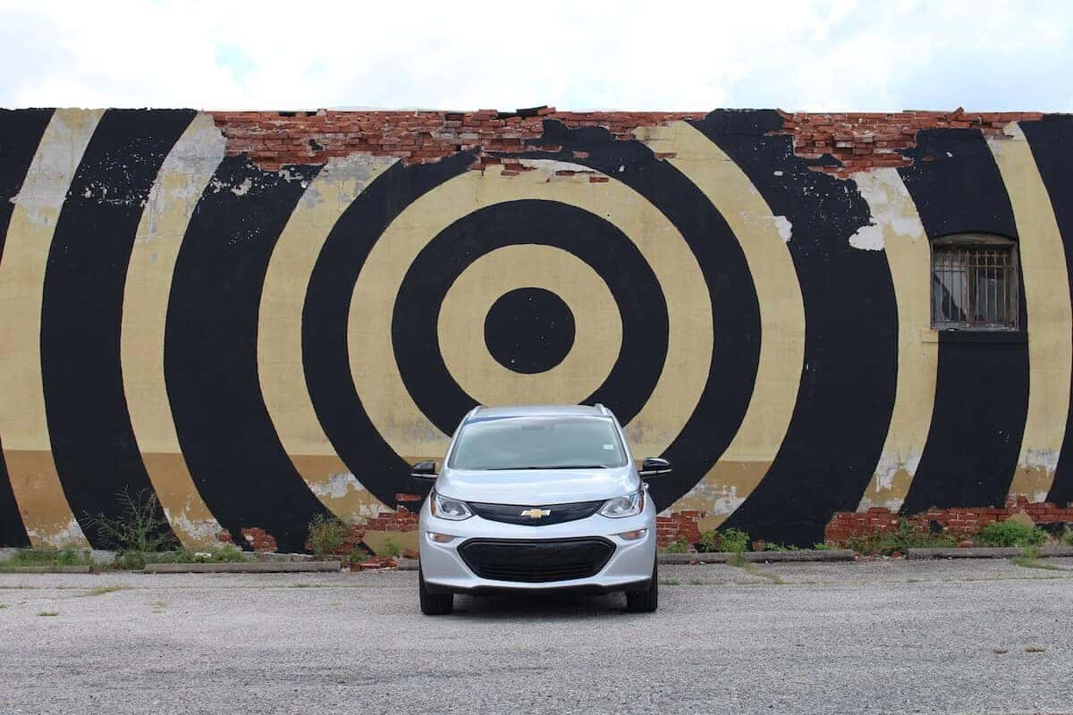 car in front of a painted wall