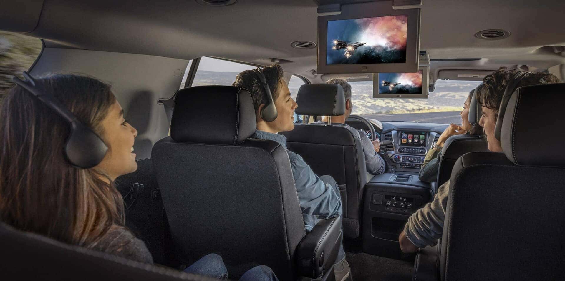 family watching movies with in car entertainment