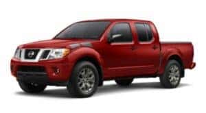 A red 2021 Nissan Frontier is angled left.