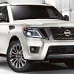 A white 2021 Nissan Armada is parked in front of Mount Juliet Nissan dealer that is washed out.