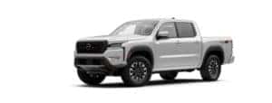 A white 2022 Nissan Frontier is angled left.