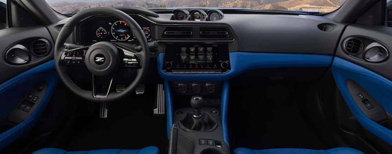 A close up shows the dash and infotainment screen in a 2023 Nissan Z.
