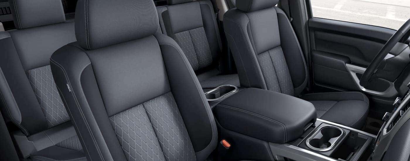 The black interior of a 2021 Nissan Titan shows two rows of seating.