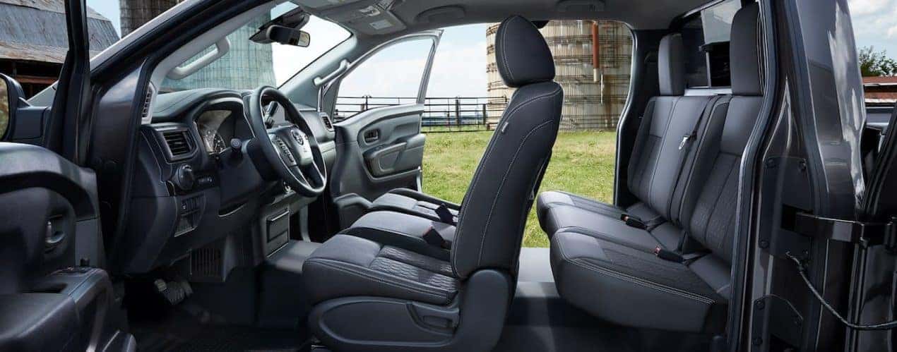 The black interior of a 2022 Nissan Titan is shown during a 2022 Nissan Titan vs 2022 Ford F-150 comparison.