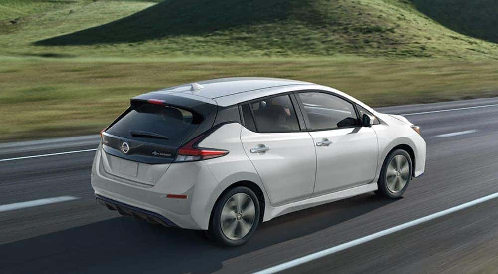A white 2021 Nissan LEAF is shown from the rear at an angle after leaving a dealer that has used cars for sale in Gallatin, TN.