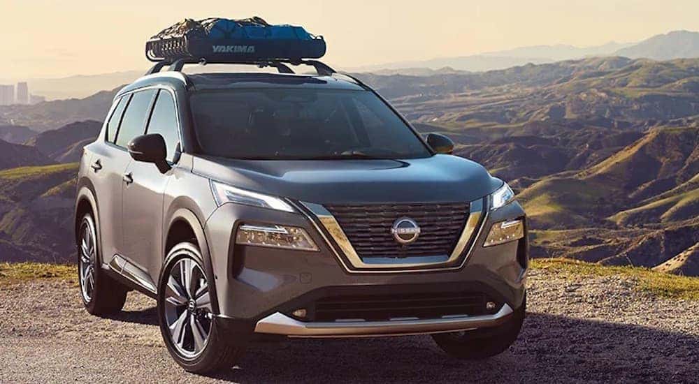 A grey 2023 Nissan Rogue is shown from the front at an angle after leaving a Portland Nissan dealer.