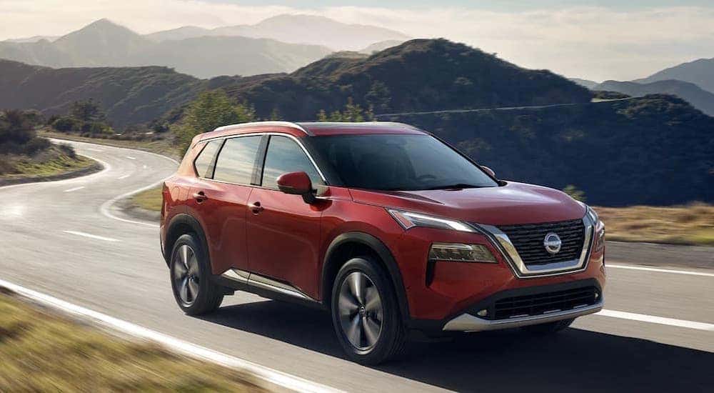 A red 2022 Nissan Rogue is shown from the front at an angle.