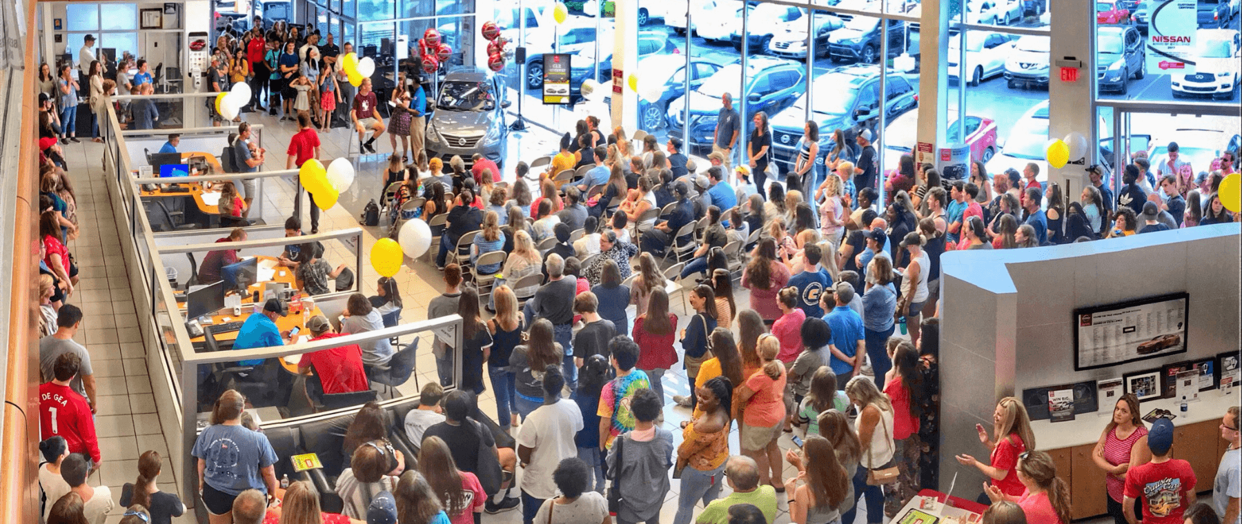 Students gather in the newton nissan showroom for the 2019 student car giveaway for high school students, an annual event in middle tn