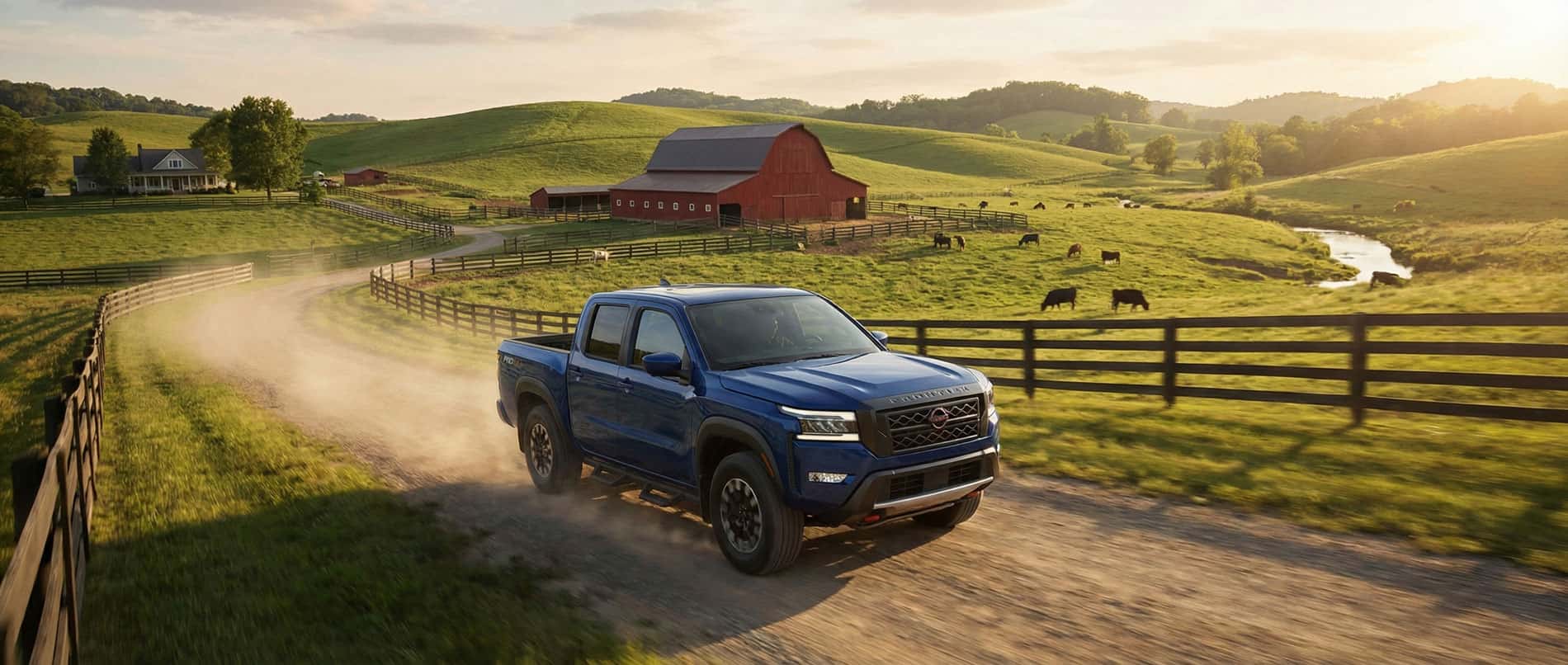 Nissan frontier driving on a farm in Greenbriar