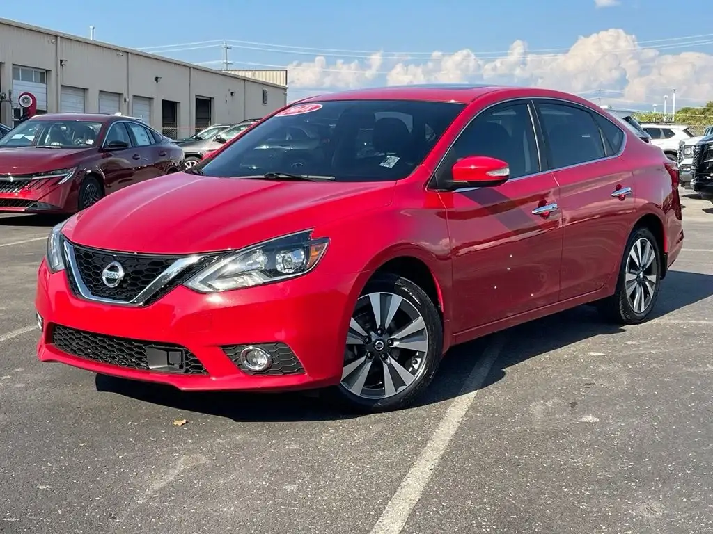 a red used nissan for sale at newton nissan of gallatin as a pre-auction line affordable small car