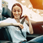 woman buckling seat belt