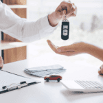 Person holding car keys in office
