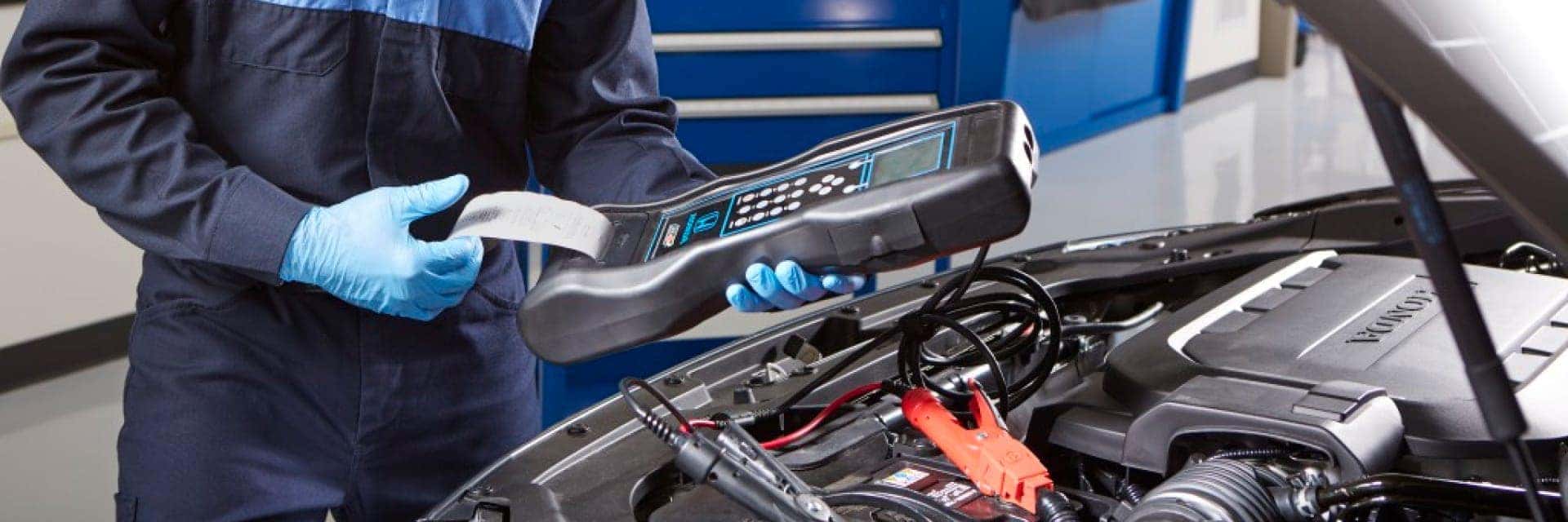 Service Tech working on car