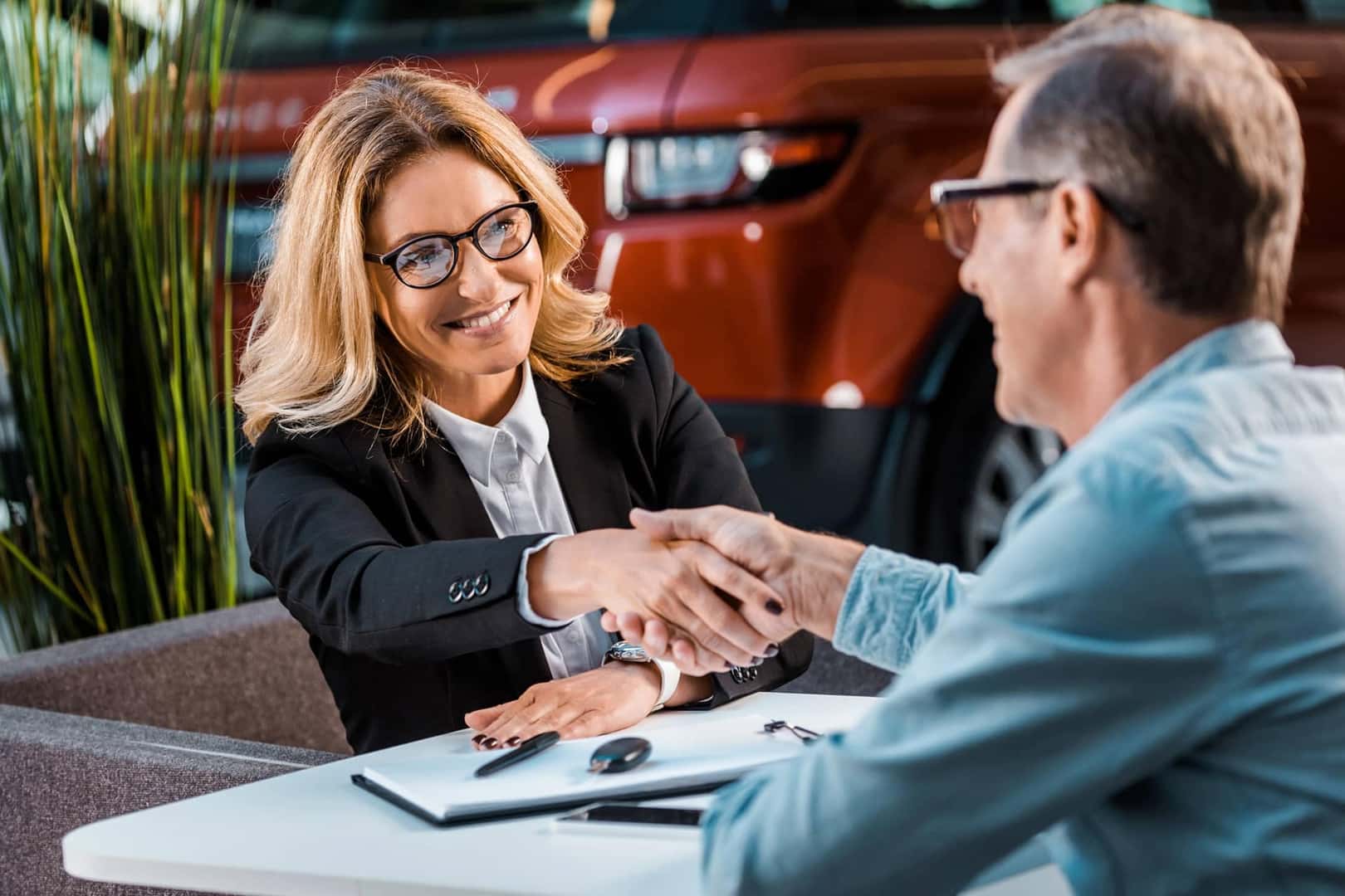 shaking hands at dealership
