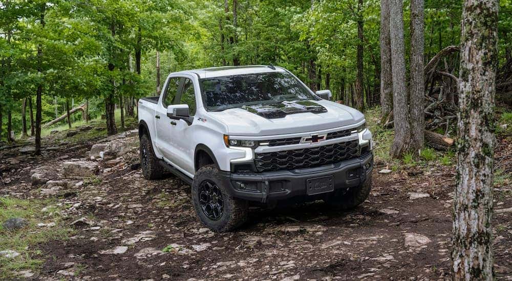 A white 2023 Chevy Silverado ZR2 is shown from the front at an angle after leaving a Chevrolet dealer in Monroe, LA.
