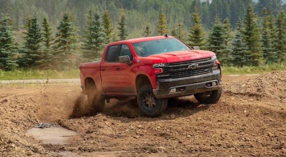 A red 2020 Chevy Silverado 1500 Z71 is shown from the front at an angle while off-road.
