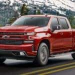 A red 2020 Chevy Silverado 1500 is shown from the front at an angle.