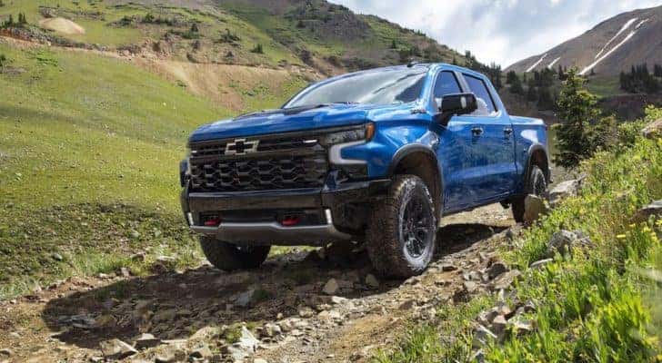 A blue 2023 Chevy Silverado 1500 ZR2 is shown from the front at an angle.