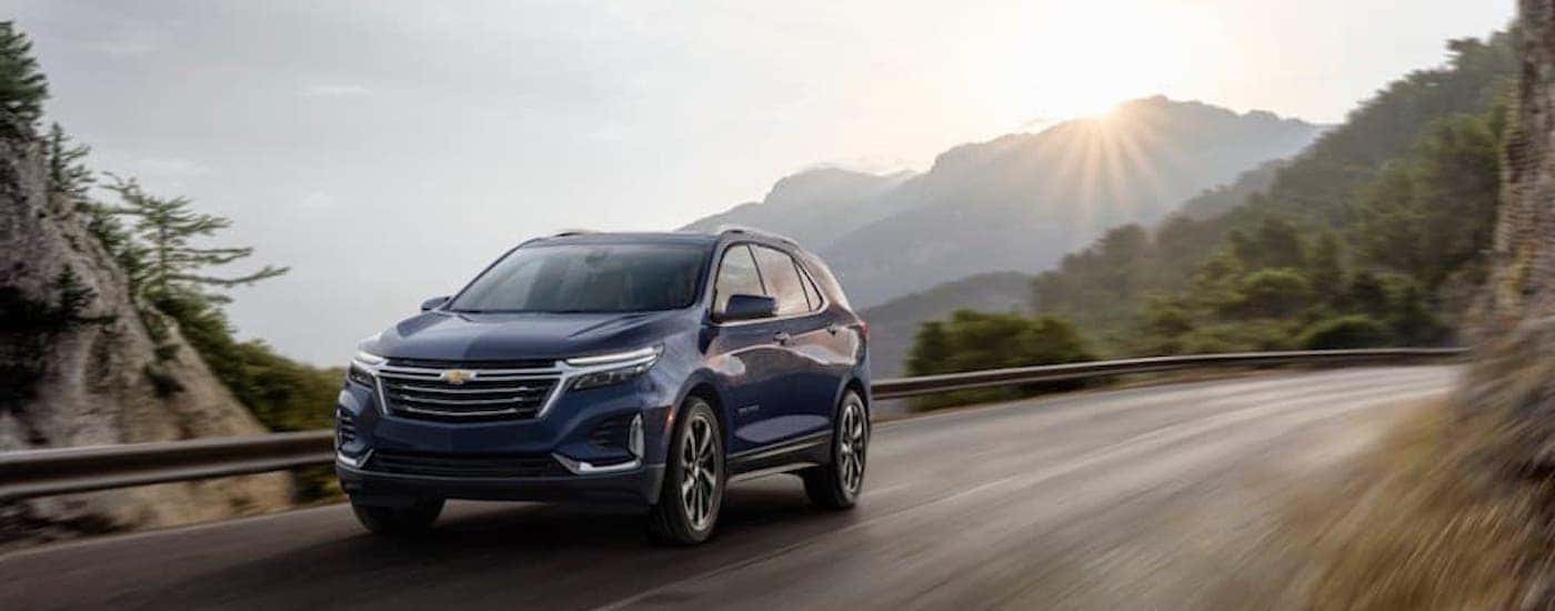 A blue 2022 Chevy Equinox Premier is shown from the front at an angle after leaving a Chevy dealership near Ruston, LA.