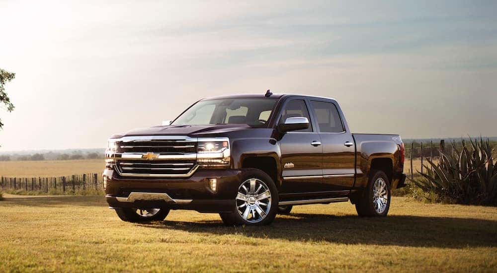 A black 2017 Chevy Silverado 1500 is shown parked on grass.
