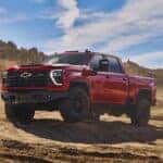 A red 2024 Chevy Silverado 2500 HD ZR2 Bison is shown from the front at an angle.