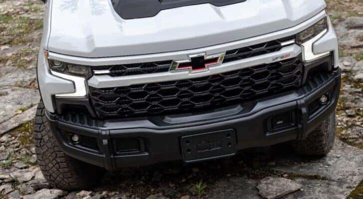 A close up of the front of a white 2023 Chevy Silverado 1500 ZR2 Bison is shown.