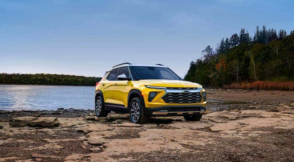 A yellow 2024 Chevy Trailblazer Activ is shown from the front at an angle after leaving a dealer that has a Chevy Trailblazer for sale.