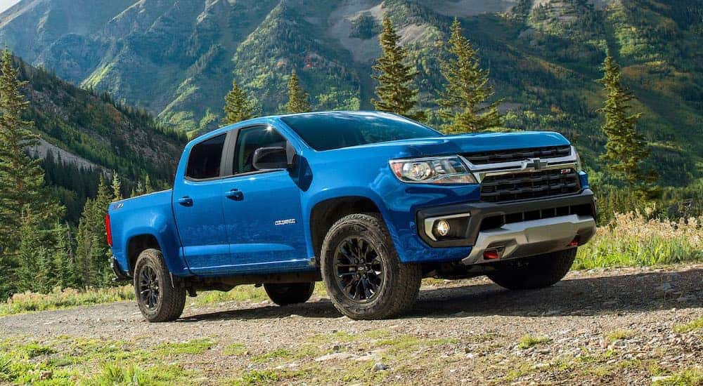 A blue 2022 Chevy Colorado is shown from the front at an angle after leaving a dealer that has used Chevy trucks for sale.