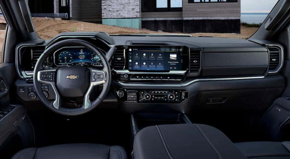 The black interior of a 2024 Chevy Silverado 3500 HD LTZ is shown from above the center console.
