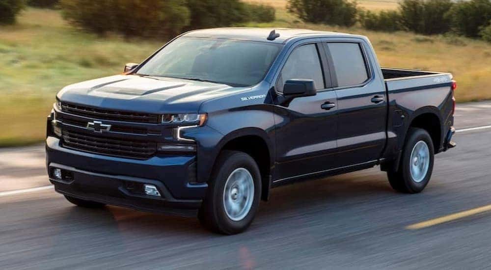 A black 2020 Chevy Silverado 1500 RST is shown driving on a highway after viewing a used Chevy Silverado for sale near Farmerville.