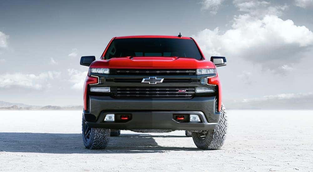 A red 2021 Chevy Silverado 1500 Z71 is shown parked off-road.